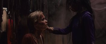 Movie still from “Silent Hill” (2006), directed by Christophe Gans – A woman getting her face waxed by another woman; Close Up shot, Over the shoulder angle