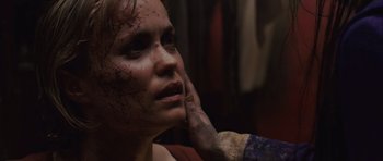 Movie still from “Silent Hill” (2006), directed by Christophe Gans – A person with blood all over her face; Close Up shot, Over the shoulder angle