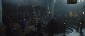 Movie still from “Silent Hill” (2006), directed by Christophe Gans – A group of people standing around a stage; Wide shot, High angle