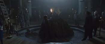 Movie still from “Silent Hill” (2006), directed by Christophe Gans – A person holding a lit candle in a circle; Wide shot, High angle