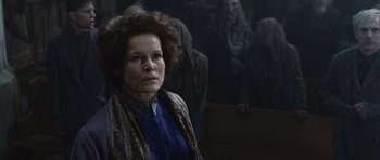 Movie still from “Silent Hill” (2006), directed by Christophe Gans – A woman in a blue shirt and a brown scarf; Close Up shot, Low angle