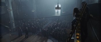 Movie still from “Silent Hill” (2006), directed by Christophe Gans – A group of people standing in the middle of a room; Extreme Wide shot, High angle