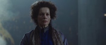 Movie still from “Silent Hill” (2006), directed by Christophe Gans – A woman in a blue shirt and a brown scarf; Close Up shot, Low angle