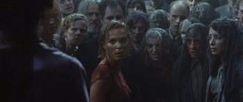 Movie still from “Silent Hill” (2006), directed by Christophe Gans – A group of people standing in a room; Medium shot, Over the shoulder angle