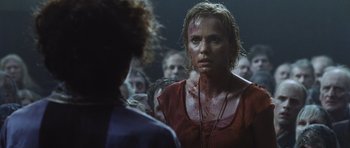 Movie still from “Silent Hill” (2006), directed by Christophe Gans – A group of people that are standing in a room; Close Up shot, Over the shoulder angle