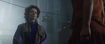 Movie still from “Silent Hill” (2006), directed by Christophe Gans – A woman standing in front of a building; Close Up shot, Low angle