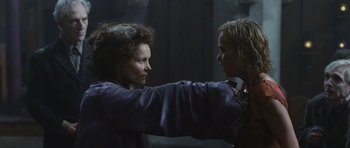 Movie still from “Silent Hill” (2006), directed by Christophe Gans – A woman and a man are fighting in a dark room; Close Up shot, Over the shoulder angle