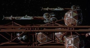 Movie still from “Silent Running” (1972), directed by Douglas Trumbull – An overhead view of a space station in the night sky; Extreme Wide shot, Overhead angle