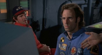 Movie still from “Silent Running” (1972), directed by Douglas Trumbull – A man and a woman are sitting in front of a computer; Close Up shot, Low angle