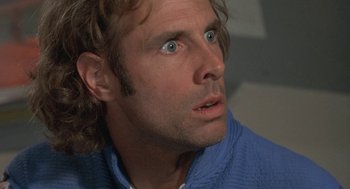 Movie still from “Silent Running” (1972), directed by Douglas Trumbull – A person with long brown hair; Close Up shot, Low angle