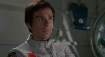 Movie still from “Silent Running” (1972), directed by Douglas Trumbull – A man in a gray jacket is looking at the camera; Close Up shot, Low angle