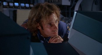 Movie still from “Silent Running” (1972), directed by Douglas Trumbull – A man sitting in front of a computer; Close Up shot, High angle