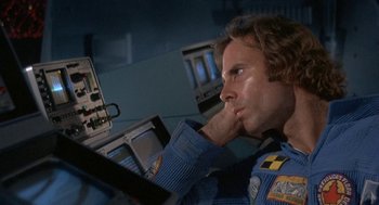 Movie still from “Silent Running” (1972), directed by Douglas Trumbull – A man sitting in front of a computer monitor; Close Up shot, Low angle