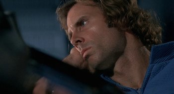 Movie still from “Silent Running” (1972), directed by Douglas Trumbull – A person with long brown hair; Close Up shot, Low angle