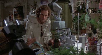 Movie still from “Silent Running” (1972), directed by Douglas Trumbull – A man sitting in front of a table with plants; Medium shot, Over the shoulder angle