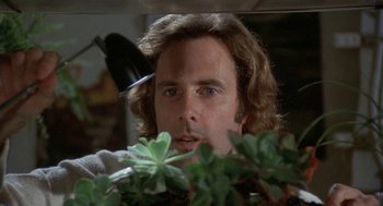 Movie still from “Silent Running” (1972), directed by Douglas Trumbull – A person near a plant; Close Up shot, Low angle