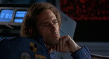 Movie still from “Silent Running” (1972), directed by Douglas Trumbull – A person with his hand under his chin; Close Up shot, Low angle