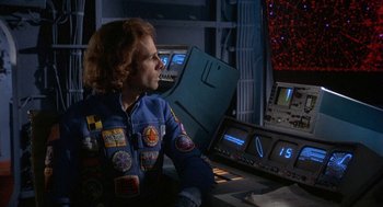 Movie still from “Silent Running” (1972), directed by Douglas Trumbull – A man sitting in front of a computer monitor; Medium shot, Over the shoulder angle