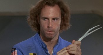 Movie still from “Silent Running” (1972), directed by Douglas Trumbull – A person holding a cell phone; Close Up shot, Low angle