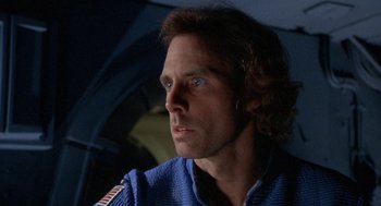 Movie still from “Silent Running” (1972), directed by Douglas Trumbull – A person wearing a blue jacket; Close Up shot, Low angle