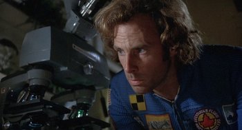 Movie still from “Silent Running” (1972), directed by Douglas Trumbull – A person wearing a blue jacket; Close Up shot, Overhead angle