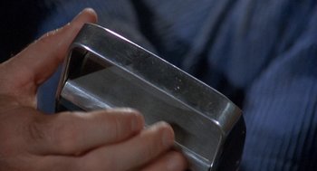 A person holding a metal object in their hand