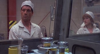 Movie still from “Silkwood” (1983), directed by Mike Nichols – A man wearing a white hat looking into a mirror; Close Up shot, Low angle