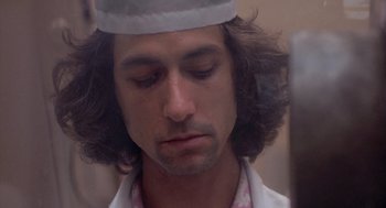 Movie still from “Silkwood” (1983), directed by Mike Nichols – A person wearing a hat; Close Up shot, Low angle