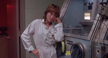 Movie still from “Silkwood” (1983), directed by Mike Nichols – A woman standing in front of a washing machine; Close Up shot, Low angle