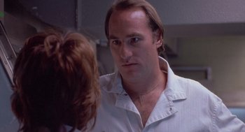 Movie still from “Silkwood” (1983), directed by Mike Nichols – A person wearing a white shirt; Close Up shot, Low angle