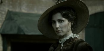 Movie still from “A Fortunate Man” (2018), directed by Bille August – A person wearing a hat; Close Up shot, Over the shoulder angle