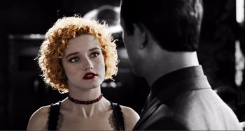 Movie still from “Sin City: A Dame to Kill For” (2014), directed by Frank Miller – A man and a woman are looking at one another; Close Up shot, Over the shoulder angle
