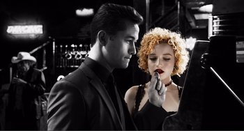 Movie still from “Sin City: A Dame to Kill For” (2014), directed by Frank Miller – A man and a woman looking at each other in front of a mirror; Close Up shot, Low angle