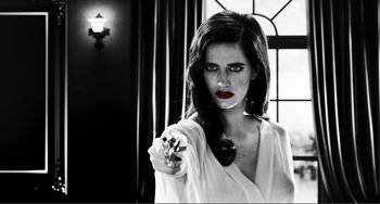 Movie still from “Sin City: A Dame to Kill For” (2014), directed by Frank Miller – A beautiful woman holding a gun in a room; Close Up shot, Low angle
