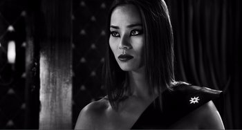 Movie still from “Sin City: A Dame to Kill For” (2014), directed by Frank Miller – Black and white photograph of a woman in a black dress; Close Up shot, Low angle