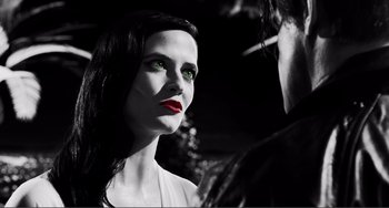 Movie still from “Sin City: A Dame to Kill For” (2014), directed by Frank Miller – A black and white photo of a woman with green eyes; Close Up shot, Low angle