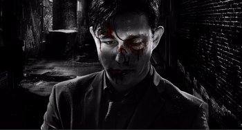 Movie still from “Sin City: A Dame to Kill For” (2014), directed by Frank Miller – A person wearing a suit with blood on his face; Close Up shot, Low angle