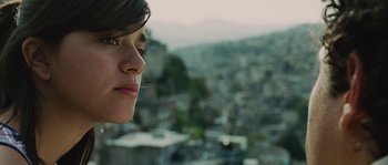 Movie still from “Sin Nombre” (2009), directed by Cary Joji Fukunaga – A person looking out a window; Close Up shot, Over the shoulder angle