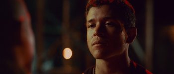 Movie still from “Sin Nombre” (2009), directed by Cary Joji Fukunaga – A person wearing a headband; Close Up shot, Low angle