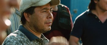 Movie still from “Sin Nombre” (2009), directed by Cary Joji Fukunaga – A person wearing a hat; Close Up shot, Over the shoulder angle
