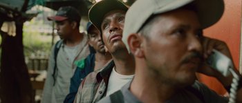 Movie still from “Sin Nombre” (2009), directed by Cary Joji Fukunaga – A group of men standing next to each other on a train; Close Up shot, Low angle