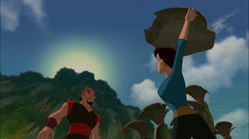 Movie still from “Sinbad: Legend of the Seven Seas” (2003), directed by Tim Johnson – An animated scene of a man and a woman in the jungle; Wide shot, Low angle