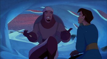 Movie still from “Sinbad: Legend of the Seven Seas” (2003), directed by Tim Johnson – A man and a woman are standing in the snow; Medium shot, Over the shoulder angle