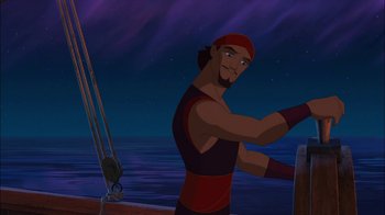 Movie still from “Sinbad: Legend of the Seven Seas” (2003), directed by Tim Johnson – A man is standing on a boat at night; Medium shot, Over the shoulder angle