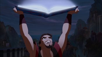 Movie still from “Sinbad: Legend of the Seven Seas” (2003), directed by Tim Johnson – A man holding a book above his head; Medium shot, Low angle