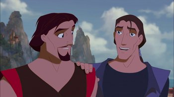 Movie still from “Sinbad: Legend of the Seven Seas” (2003), directed by Tim Johnson – Two men standing next to each other in front of a mountain; Close Up shot, Over the shoulder angle
