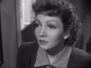 Movie still from “Since You Went Away” (1944), directed by John Cromwell – An old photo of a woman looking at the camera; Close Up shot, High angle