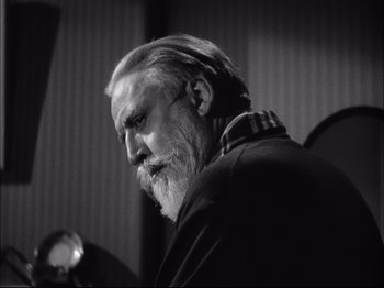 Movie still from “Since You Went Away” (1944), directed by John Cromwell – An old man with a beard is looking at something; Close Up shot, Low angle