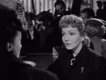 Movie still from “Since You Went Away” (1944), directed by John Cromwell – An old black and white photo of a woman talking to another woman; Close Up shot, Over the shoulder angle