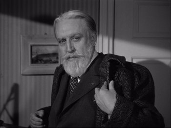 Movie still from “Since You Went Away” (1944), directed by John Cromwell – An old man with a beard and a suit; Close Up shot, Low angle